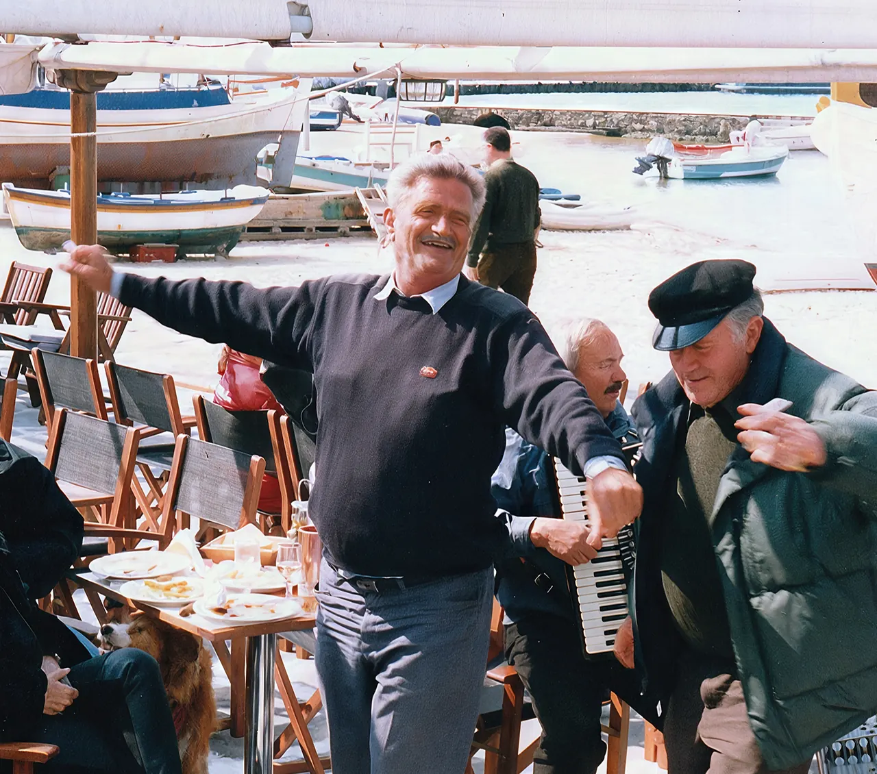 Yiannis Kousathanas dancing in the harbour of Mykonos Town